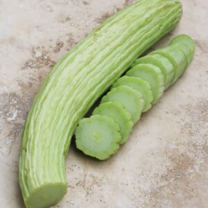 A long green vegetable with several slices