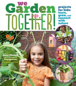 We Garden Together book, with a child holding a plant