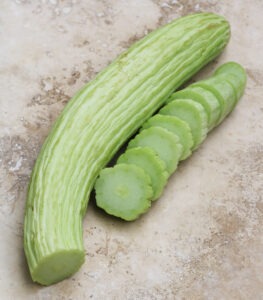 long, light-green cucumber and cucumber slices
