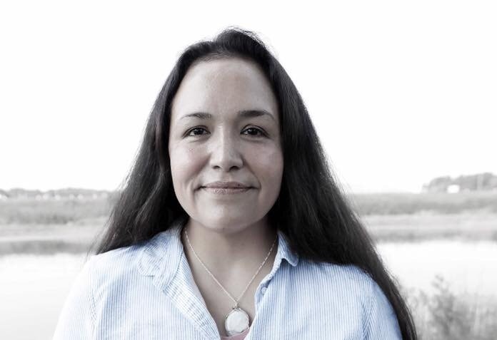 Woman with long dark hair.