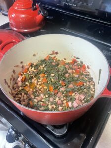 A pot of simmering vegetables on a stove