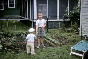 Craig smiles from his first garden, grown in 1962 in Rhode Island.