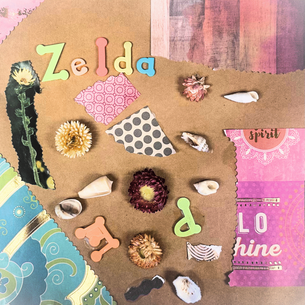 A scrapbook page with an assortment of colorful paper, foam letters, strawflowers, and sea shells.