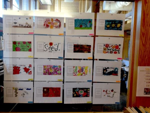 A display of 16 pieces of paper featuring various colorful abstract drawings